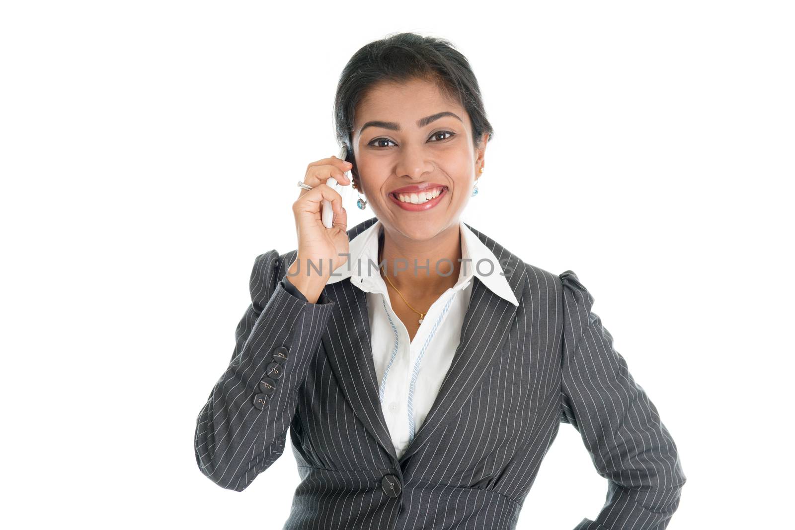 Black business woman talking on smartphone and smiling, isolated on white background.