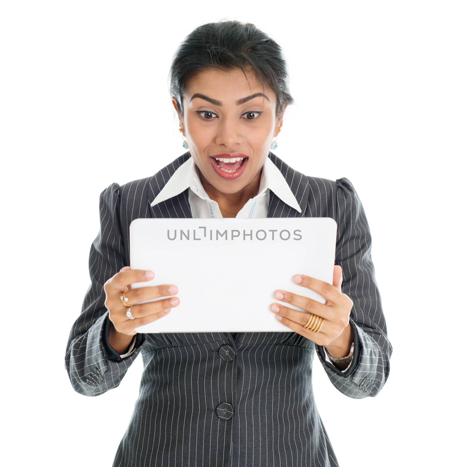 Black business woman using tablet pc and getting shocked, isolated on white background.