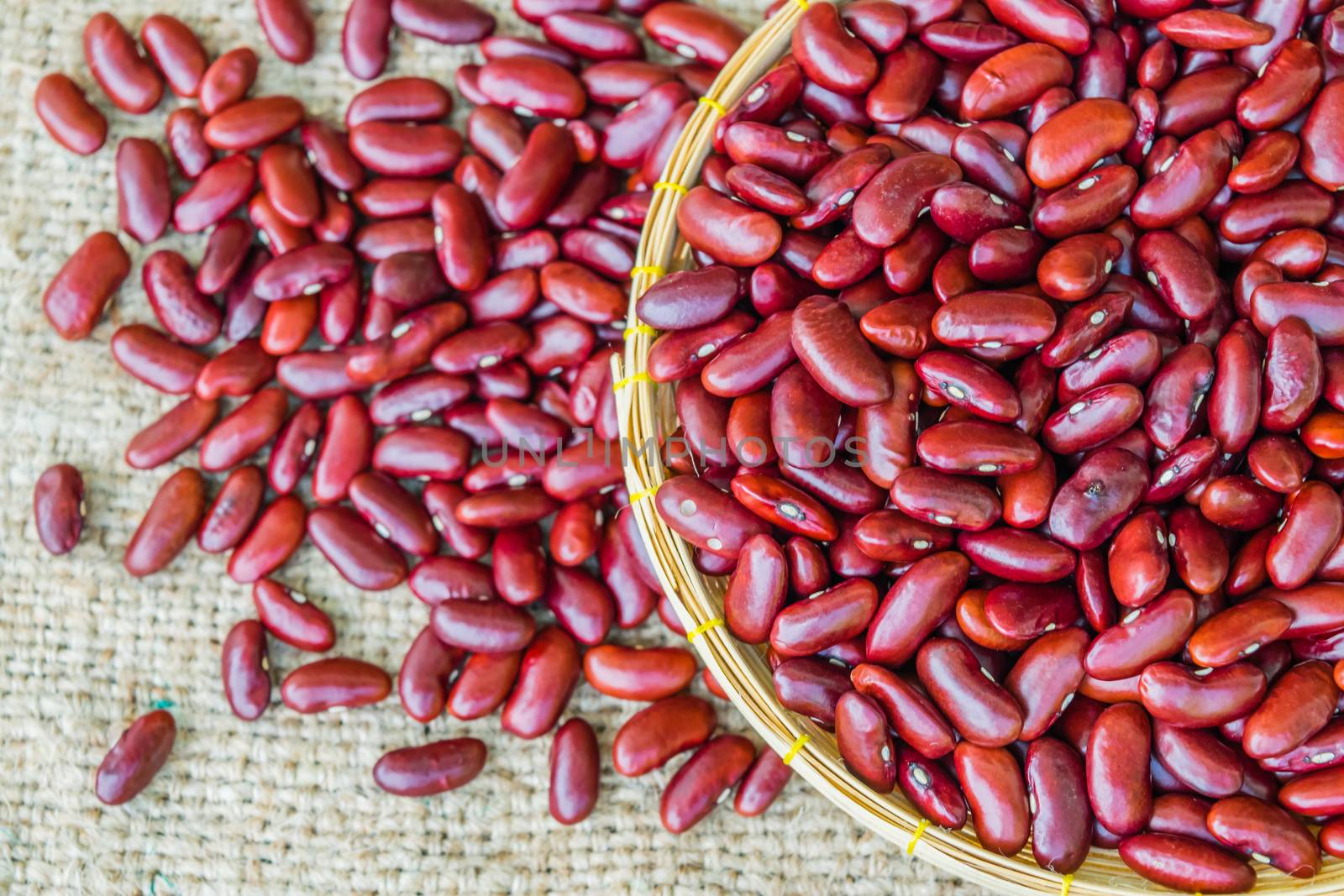 Dried red beans on a sack background