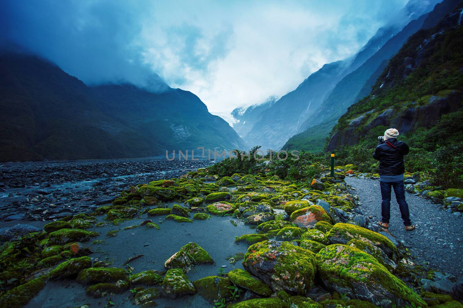 photographer take a photograph in franz joseft glacier south island new zealand