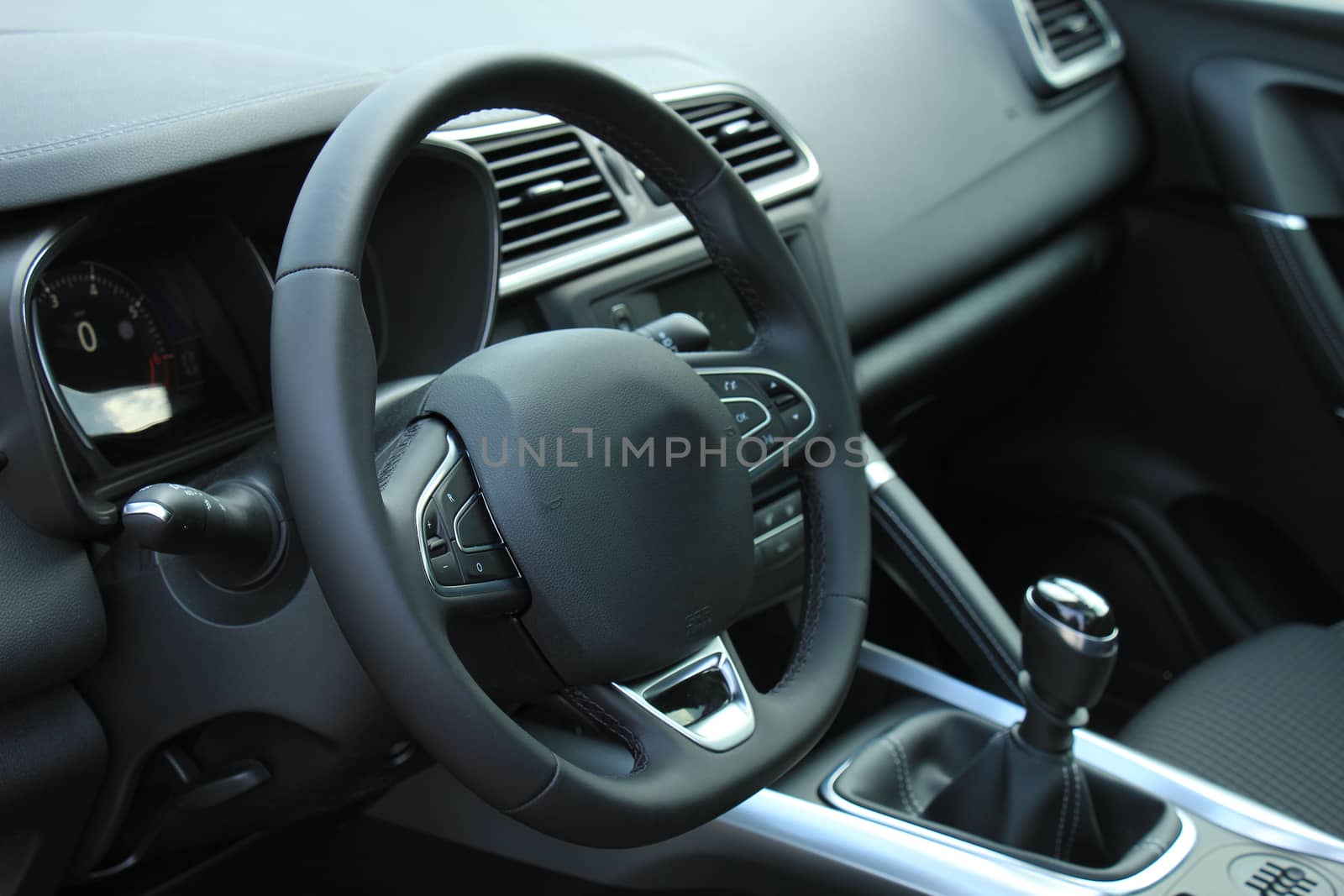 Modern car interior, luxurious materials in different shades of grey