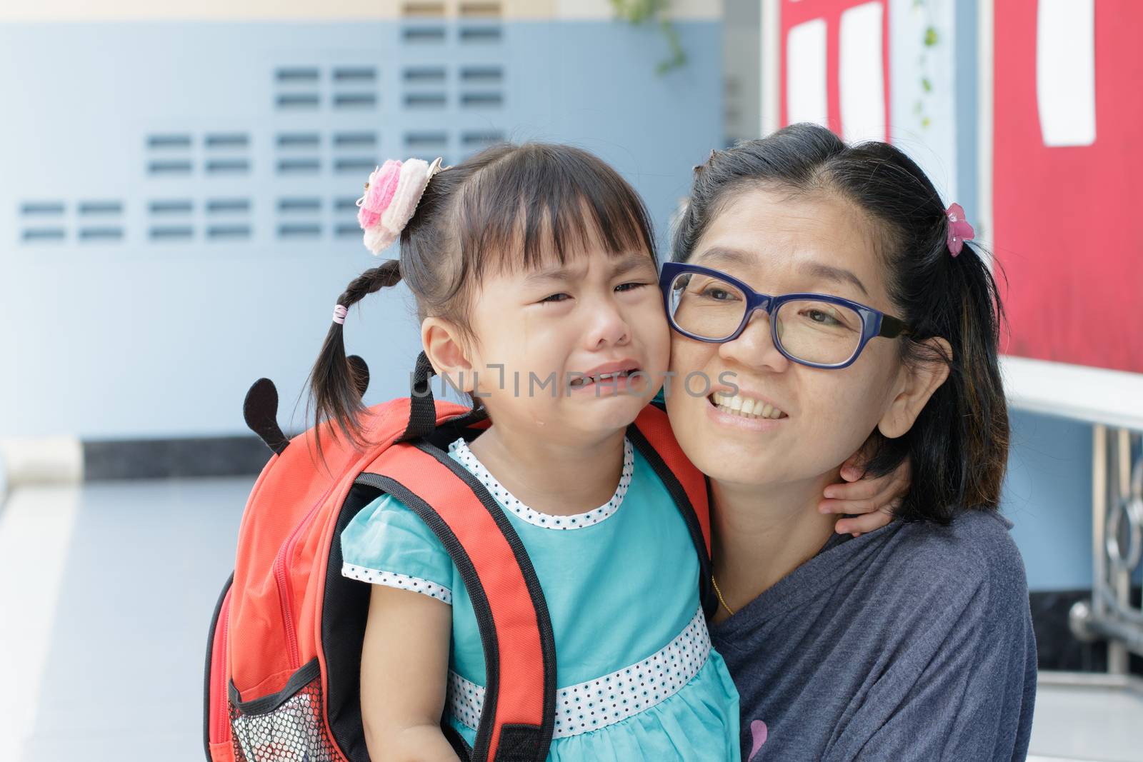children and mother crying first day go to pre-kindergarten scho by khunaspix