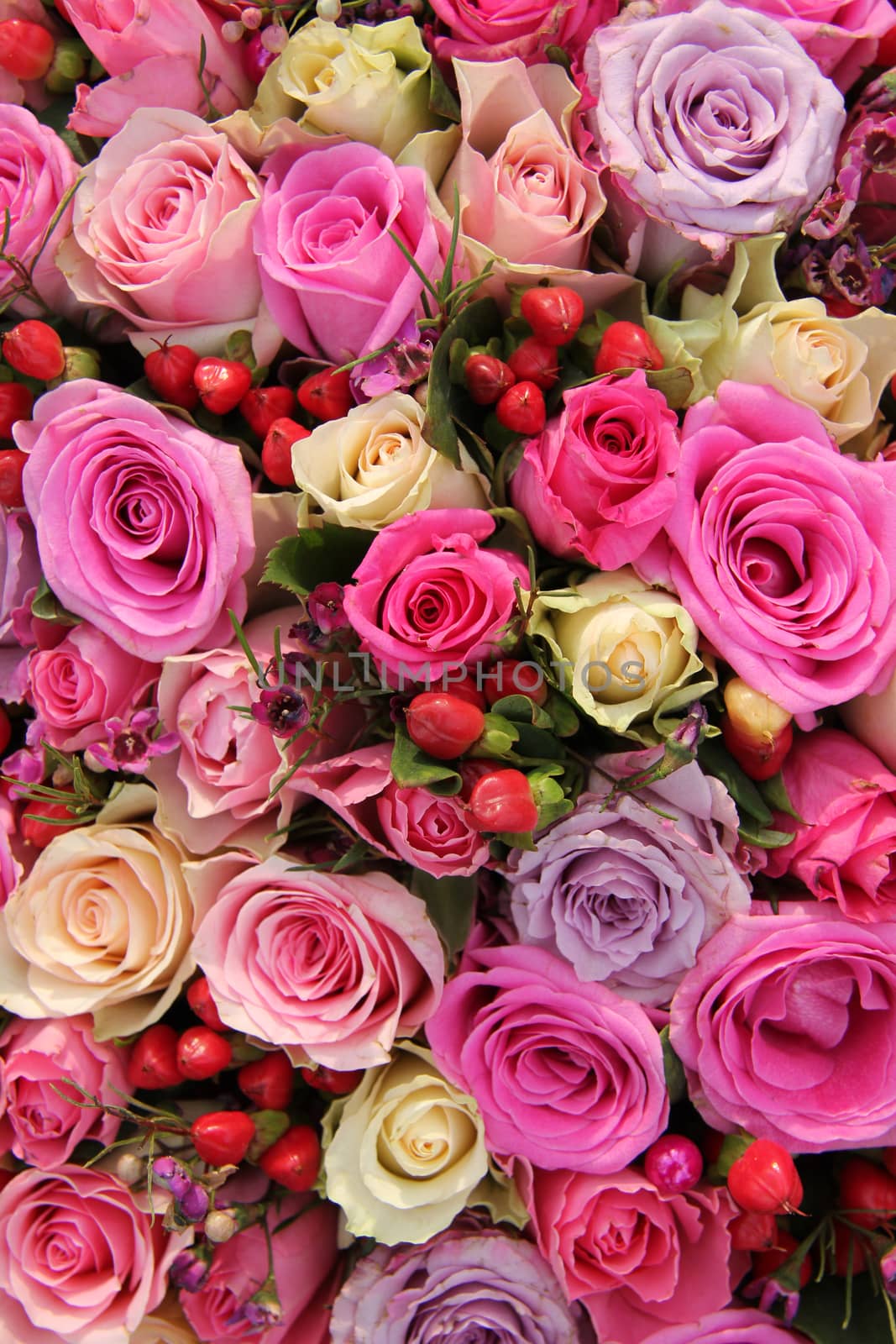 Bridal rose arrangement in various shades of pink by studioportosabbia