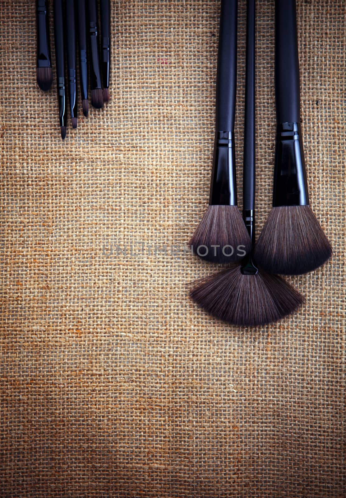 set of cosmetic set on natural fabric texture 