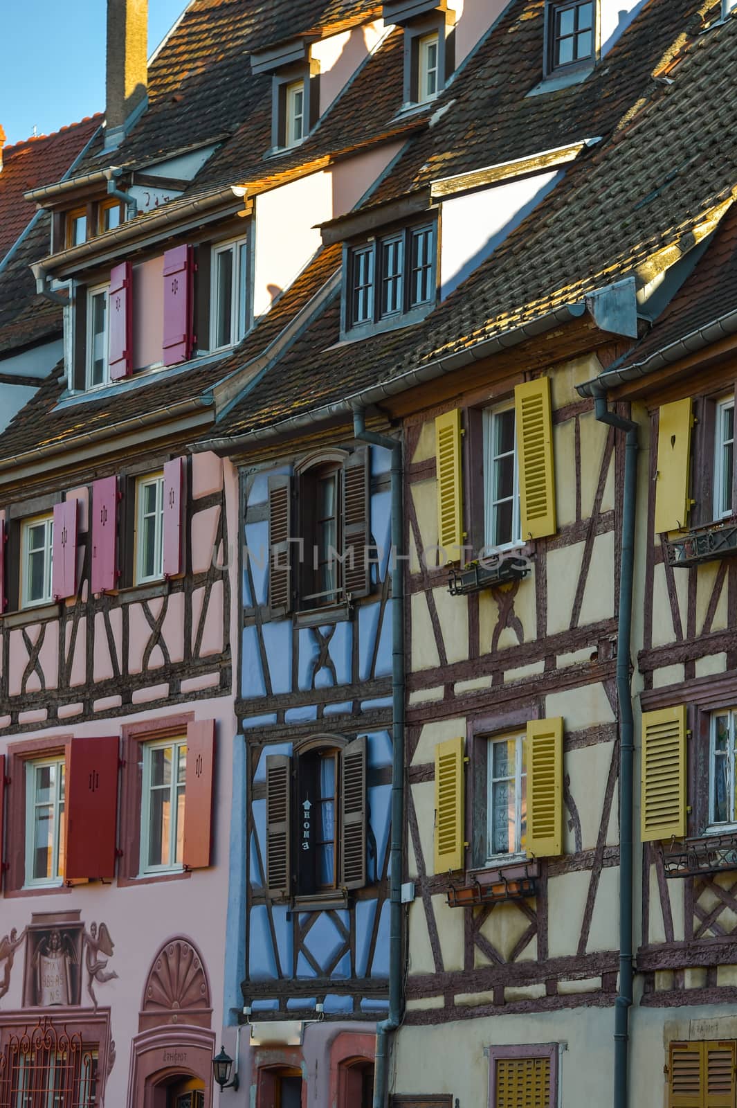 Colorful traditional french houses on the side of river Lauch in Petite Venise, Colmar, France