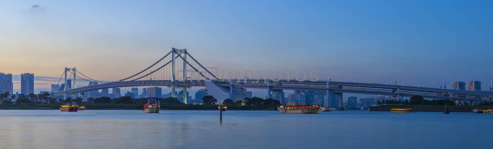 beautiful dusky sky city scape of rainbow bridge important landmark and town transportation in odaiba tokyo japan