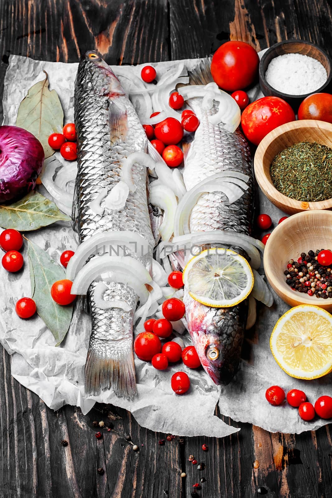 Carcass raw fish on the kitchen table with spices