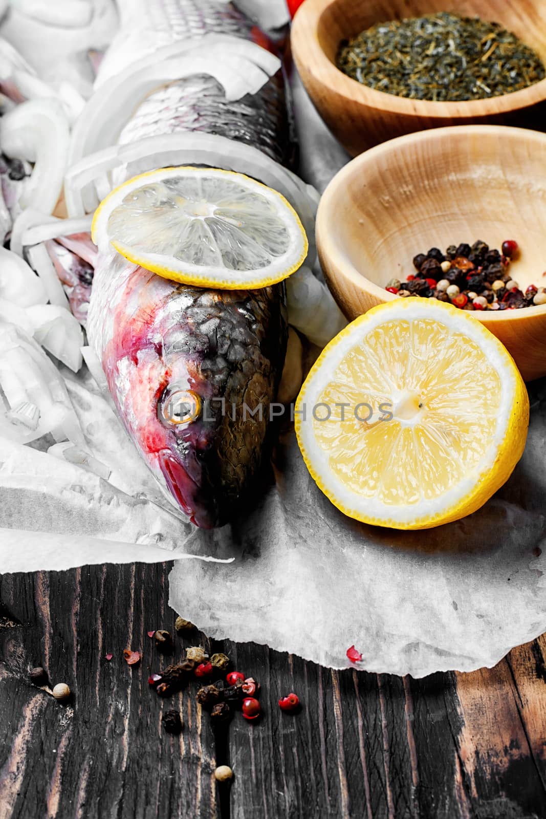 Carcass raw fish on the kitchen table with spices