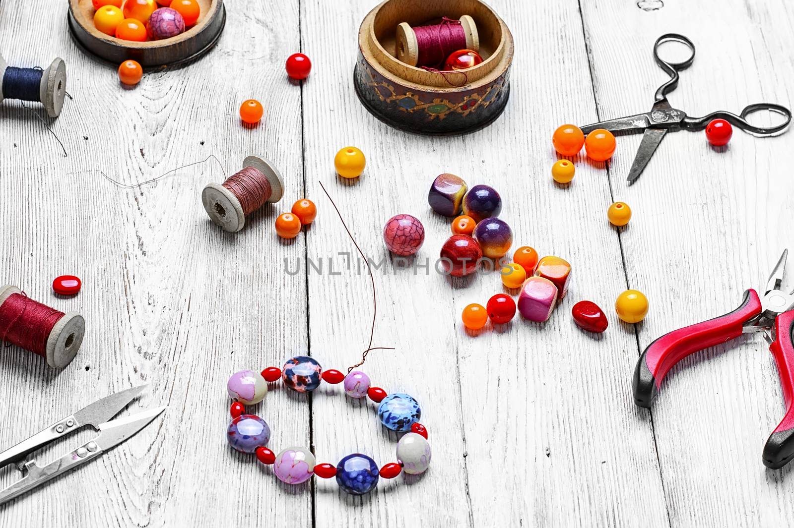 Range of decorative beads for bracelet and tool