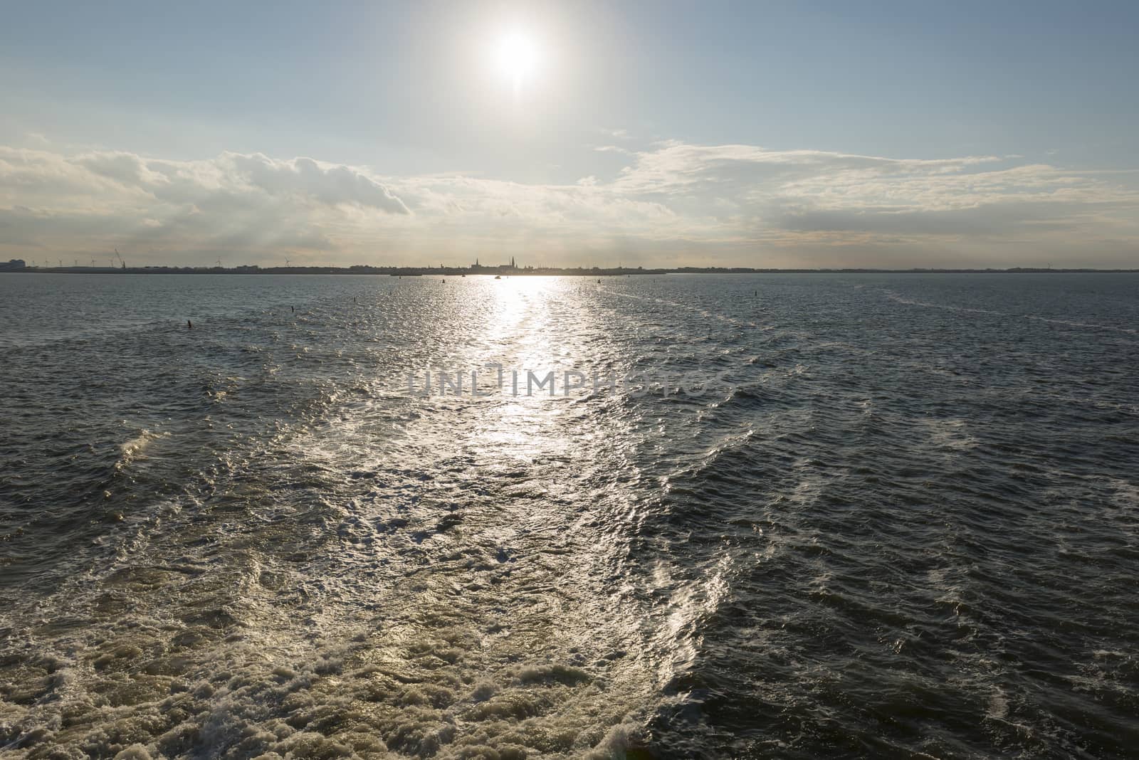 Wake behind the ferry from Harlingen to Vlieland in the Netherla by Tofotografie