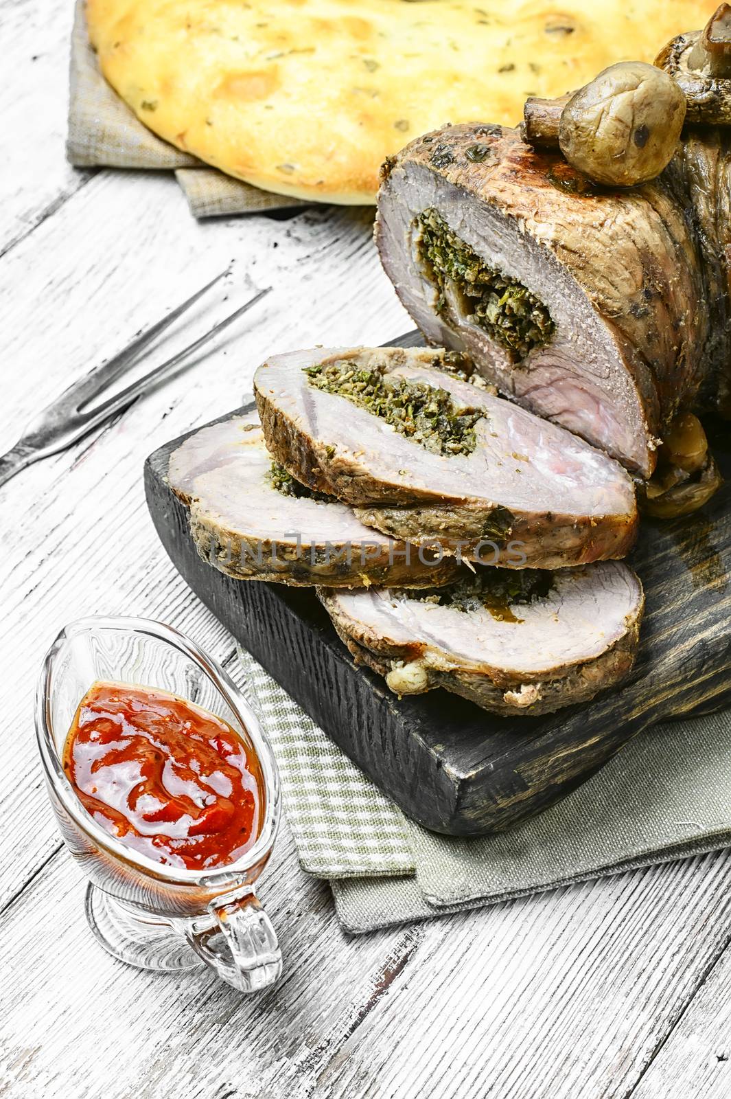 Meatloaf of veal stuffed with and assortment of sauces