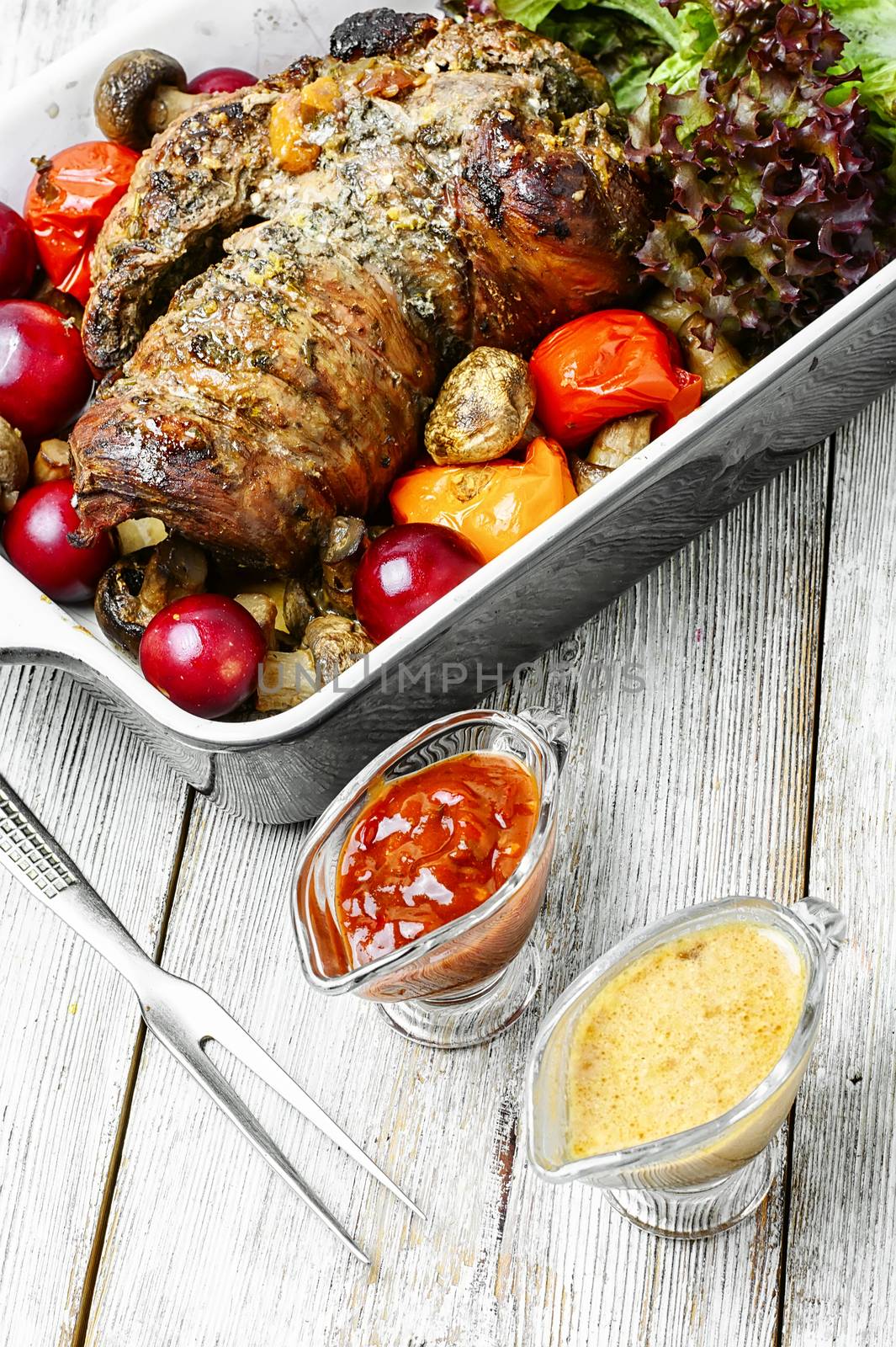 Meatloaf of veal stuffed with and assortment of sauces