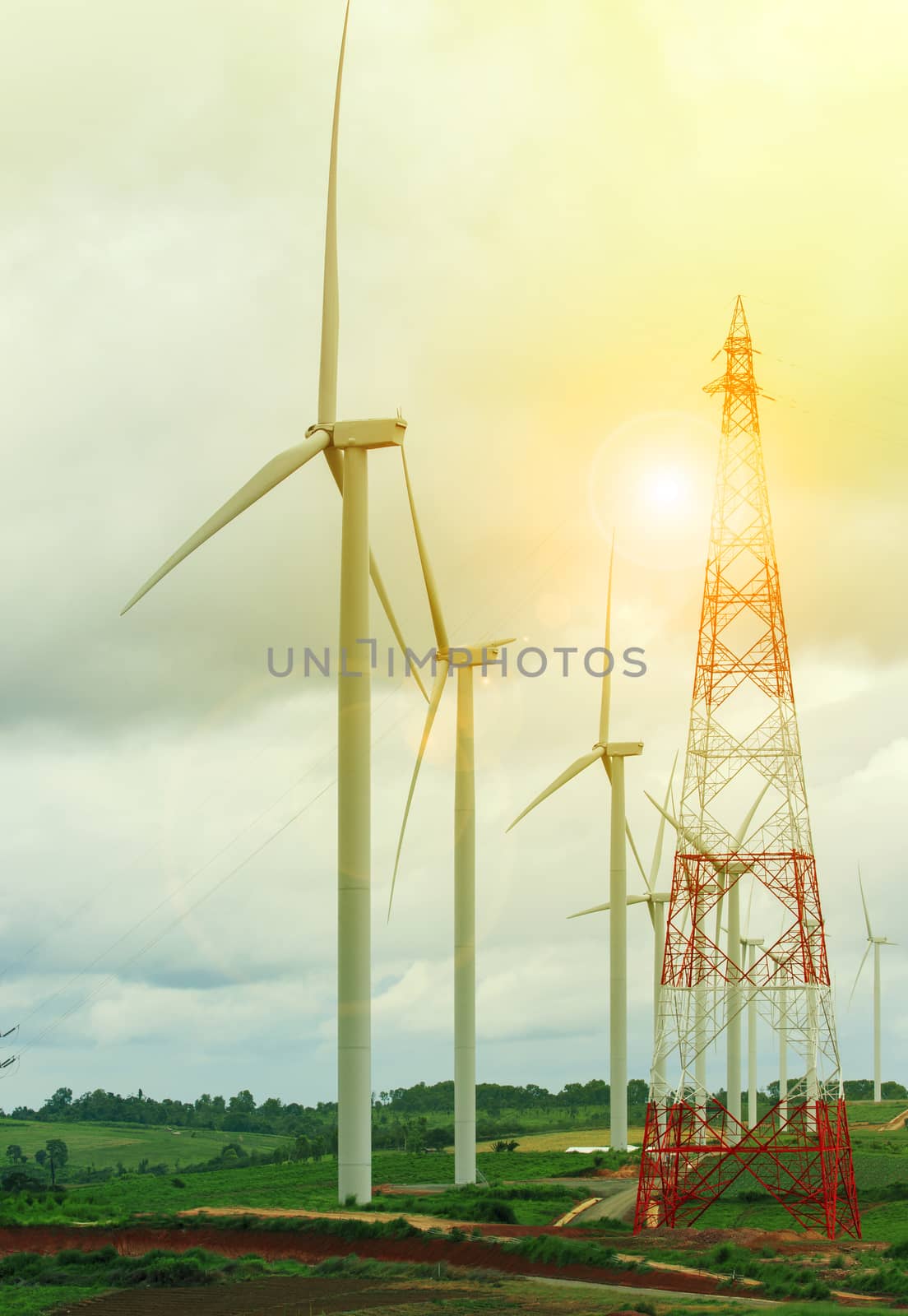 wind mill turbine in electric generating farm land 