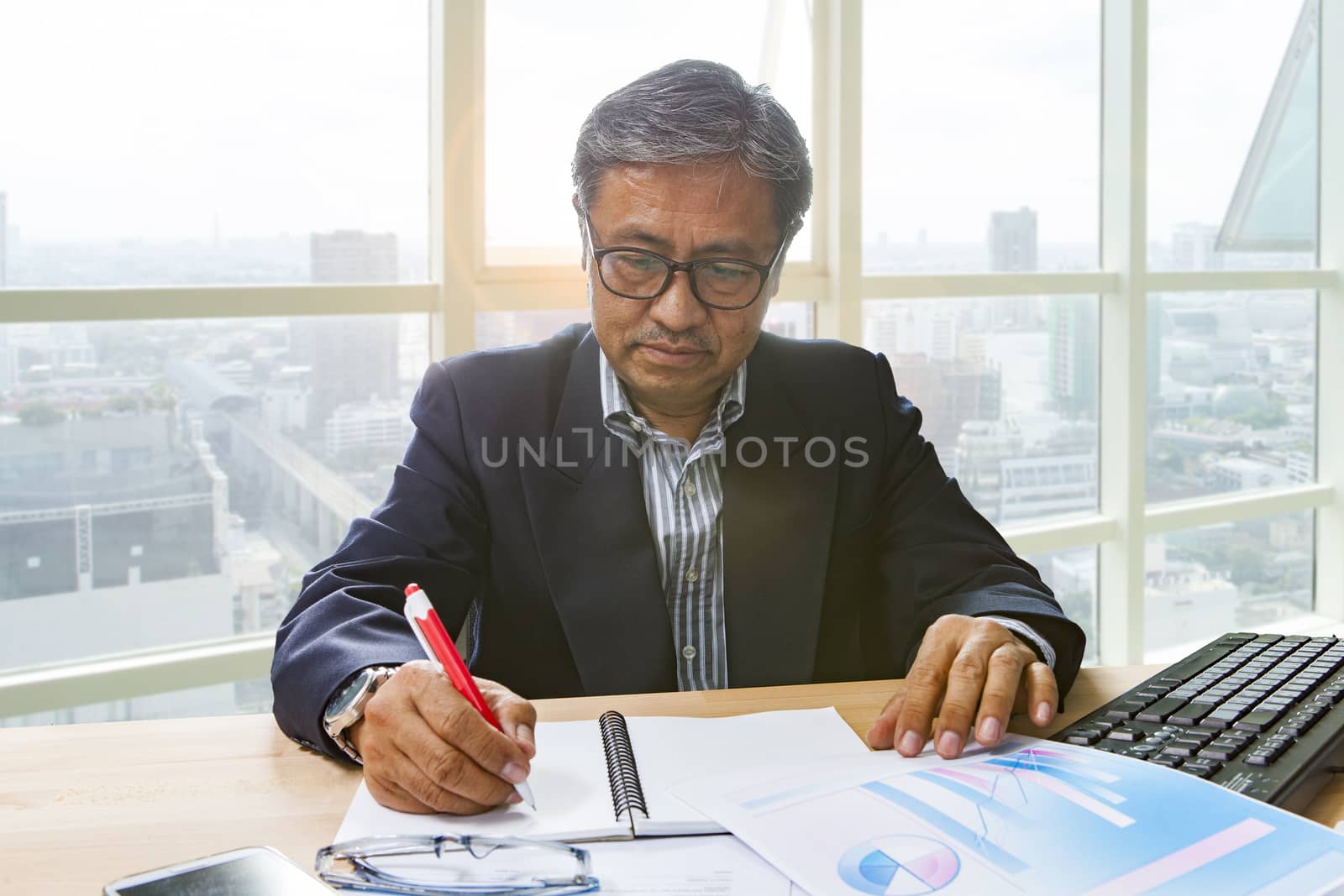 senior business man working on office table