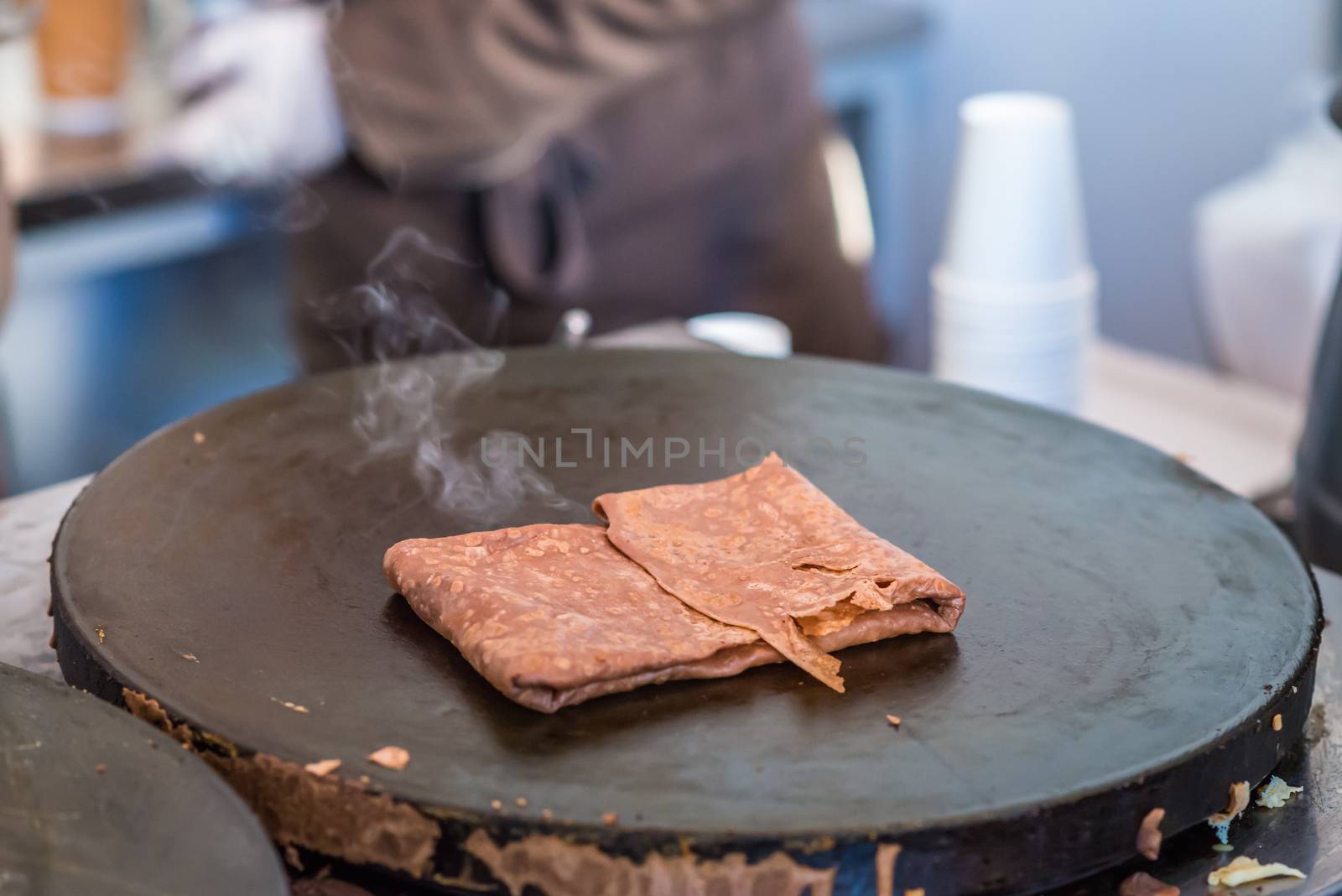 chocolate hot pancake fried on the stove