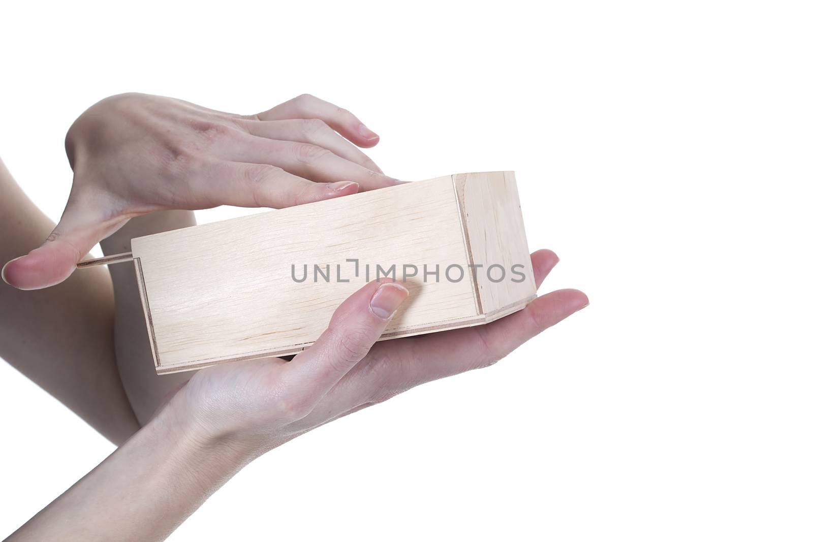 Hands of woman open wooden box on a white background