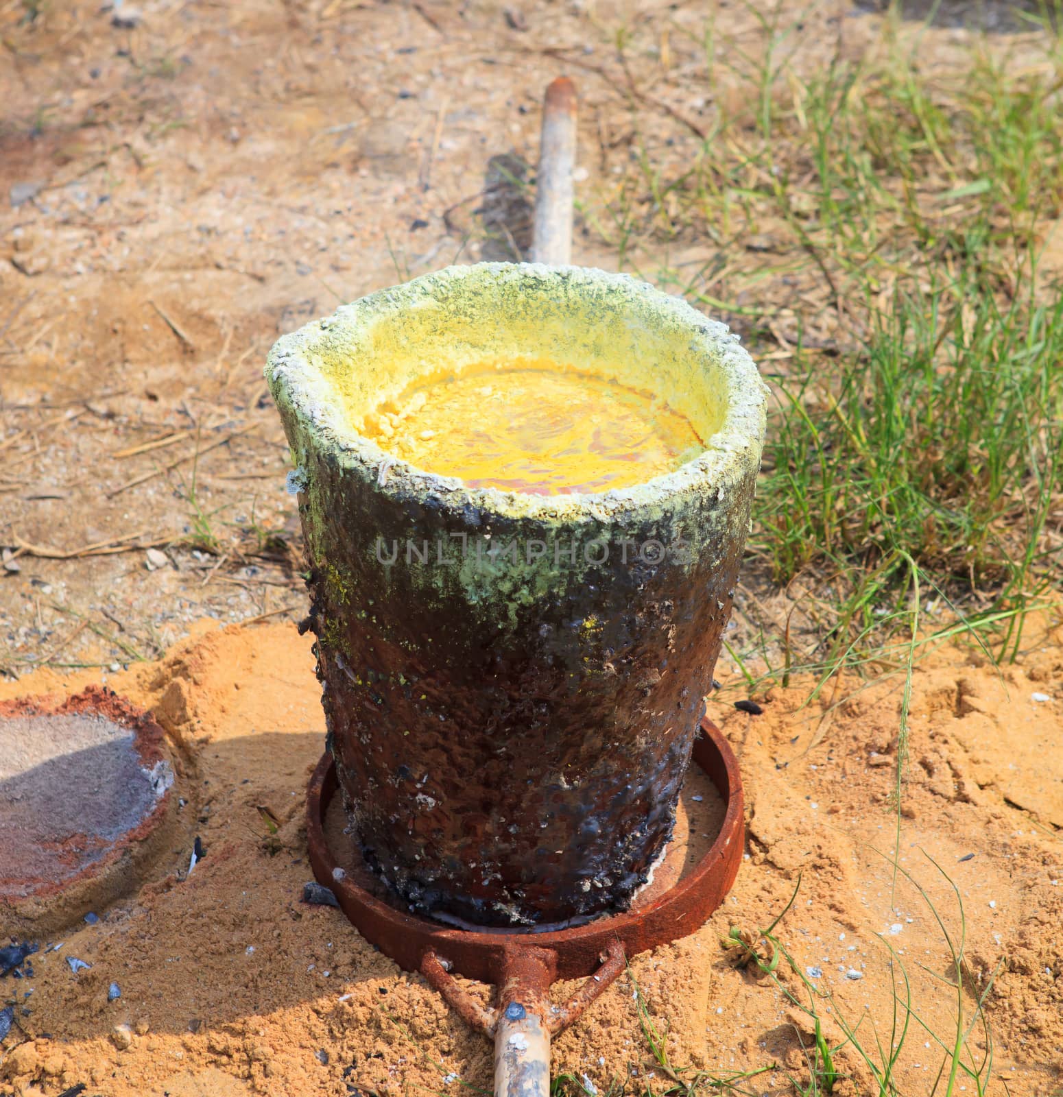 brass metal melt in heat bucket use for make brass  metal buddha statue in thailand