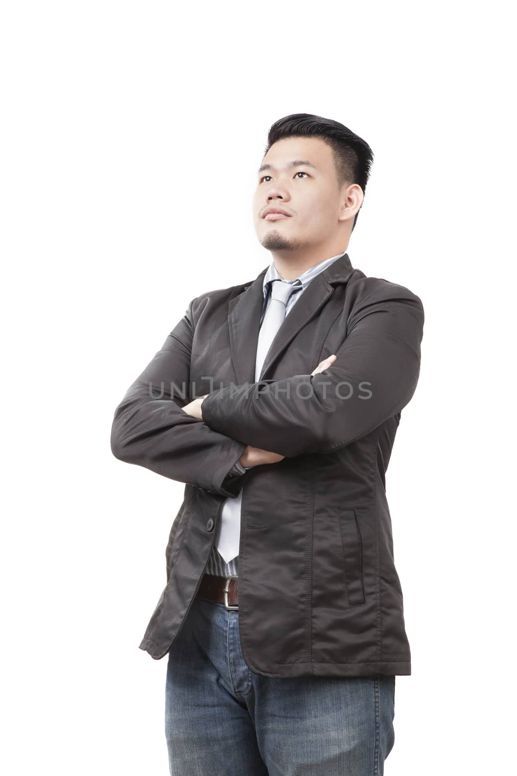 face of young asian man wearing western suit standing and looking upper view isolated white background use for people and business man theme