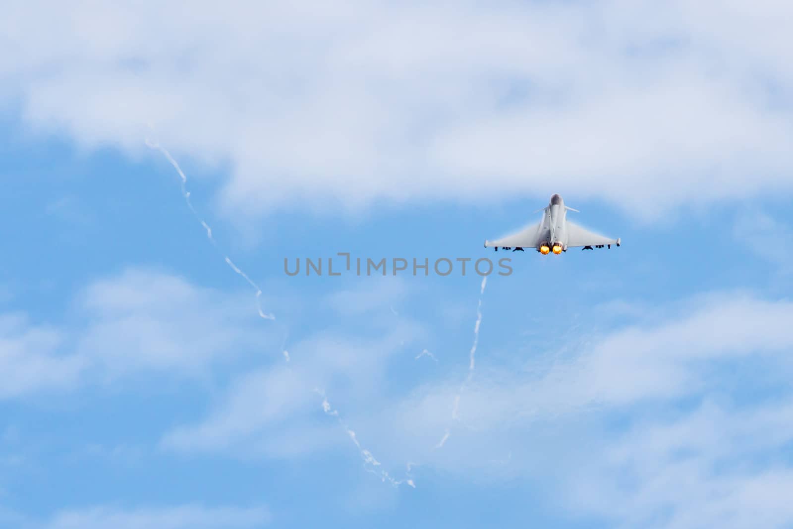 Fighter Jet flying away from camera