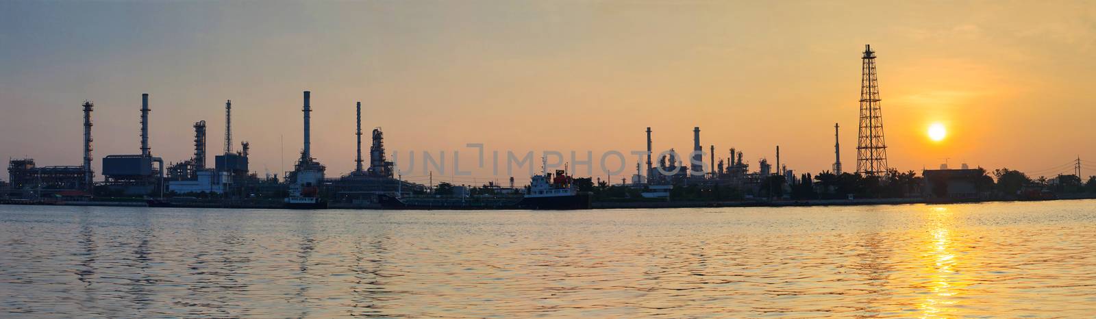 beautiful sun rising scene with oil ,gas refinery industry estat by khunaspix