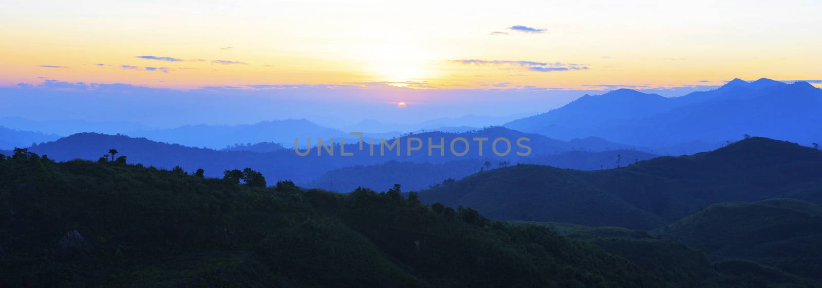 panorama view of sun rising over mountain scene use for natural  by khunaspix