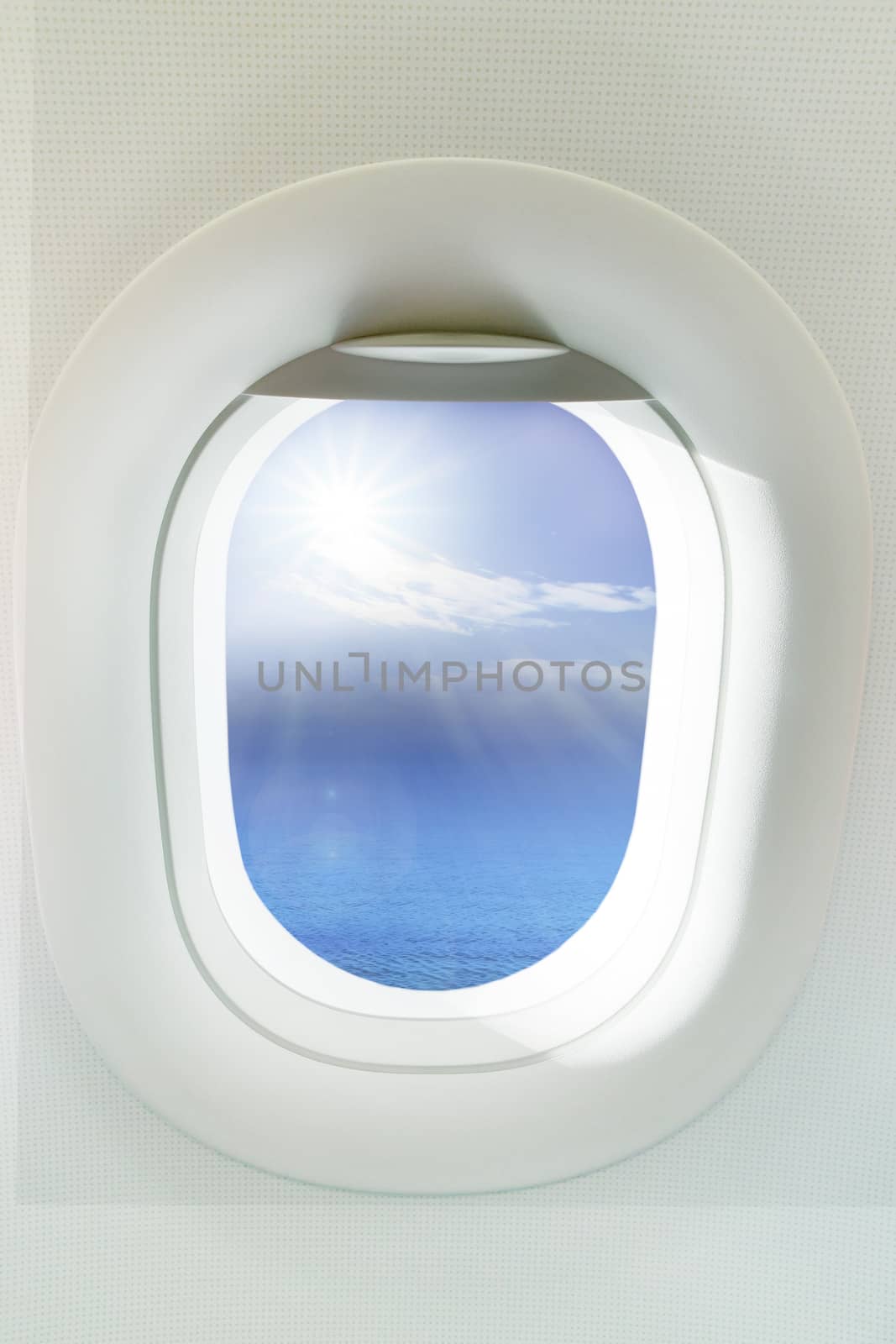 beautiful sun shining over clear blue ocean through  frame of windows palne  use as background,backdrop