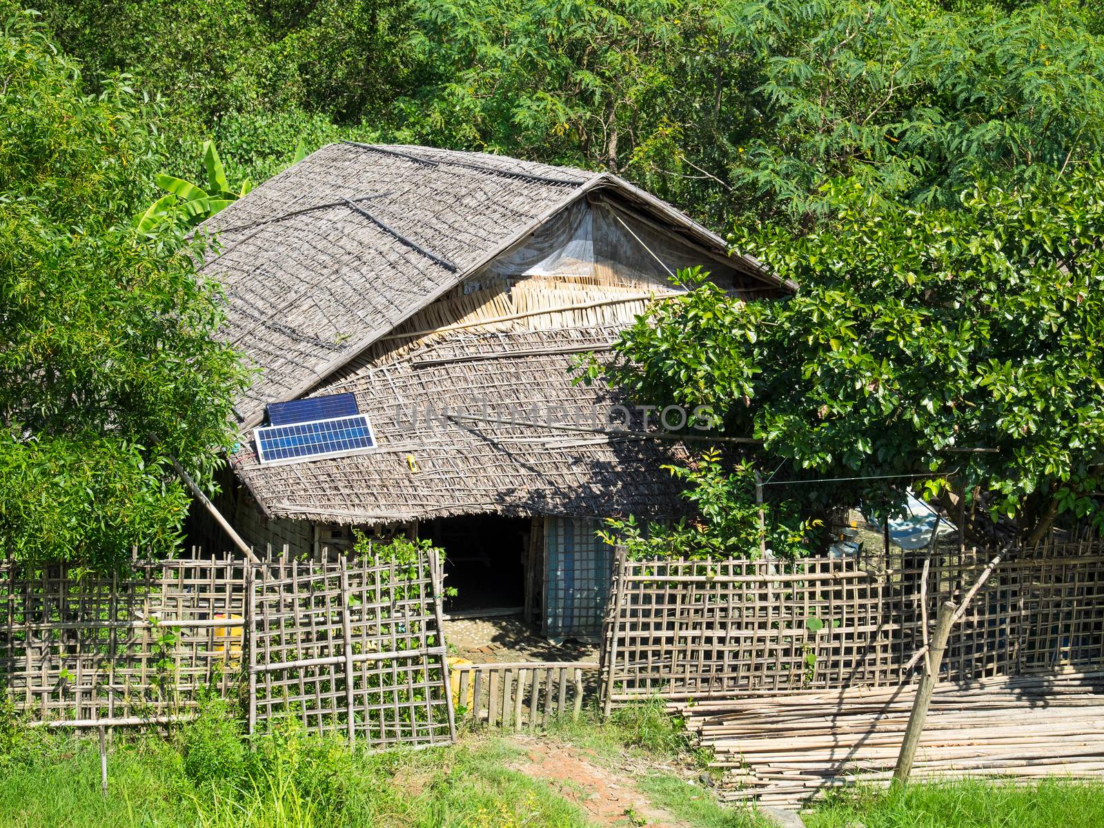Traditional house made from straw in a village along the Kaladan River in the Rakhine State of Myanmar.