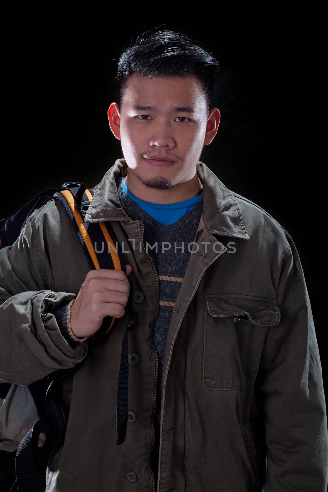 young asian man carrying back pack use for people traveling and vacation holiday activities