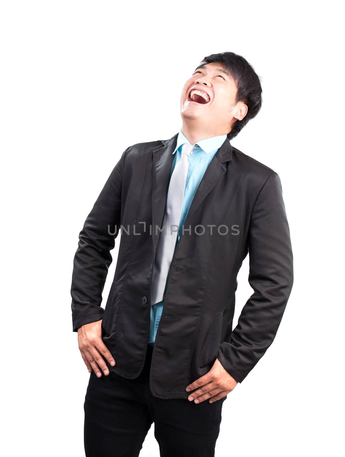 portrait face of young asina business man laughing isolated on w by khunaspix