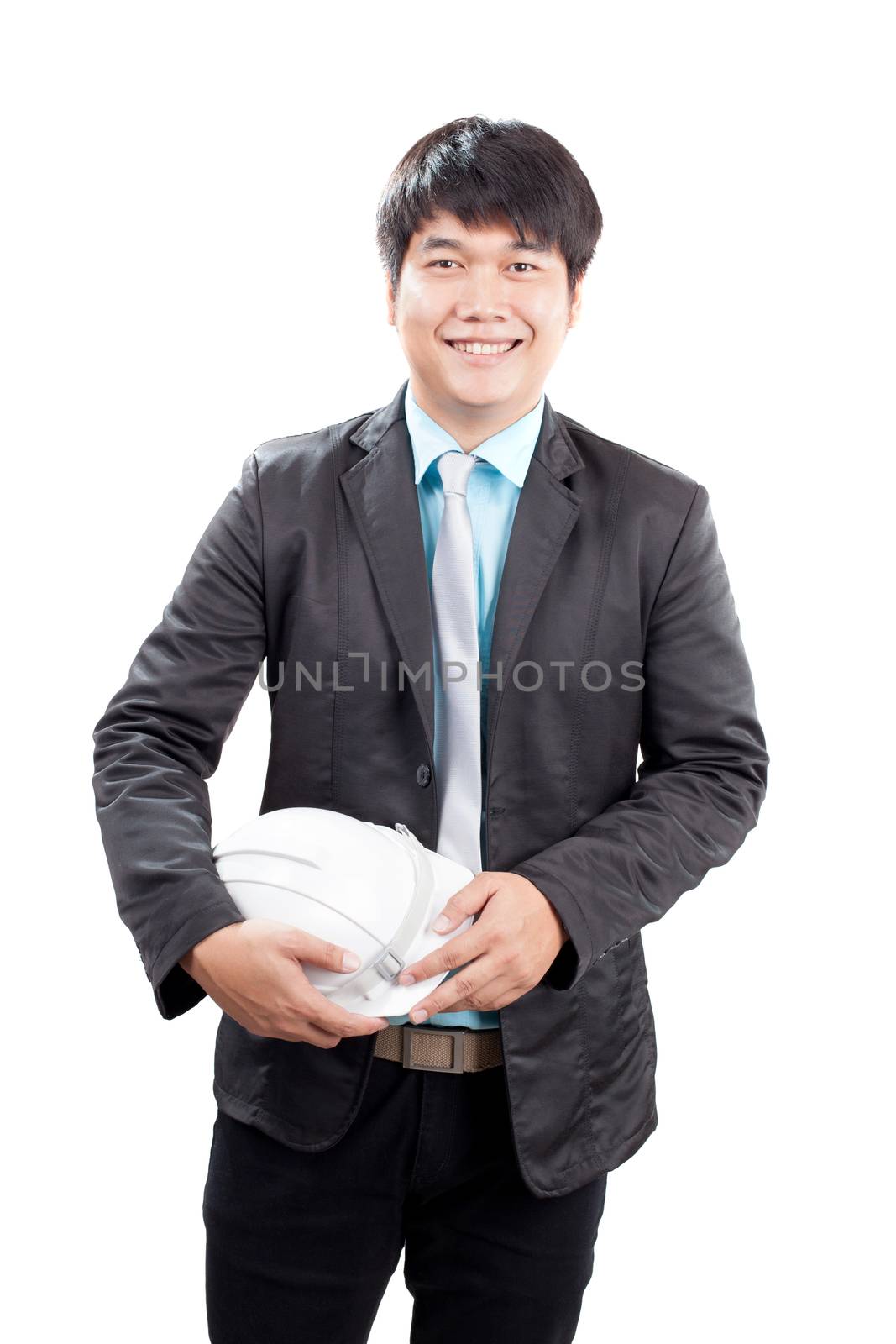 young asian engineering man standing and holding safety helmet i by khunaspix