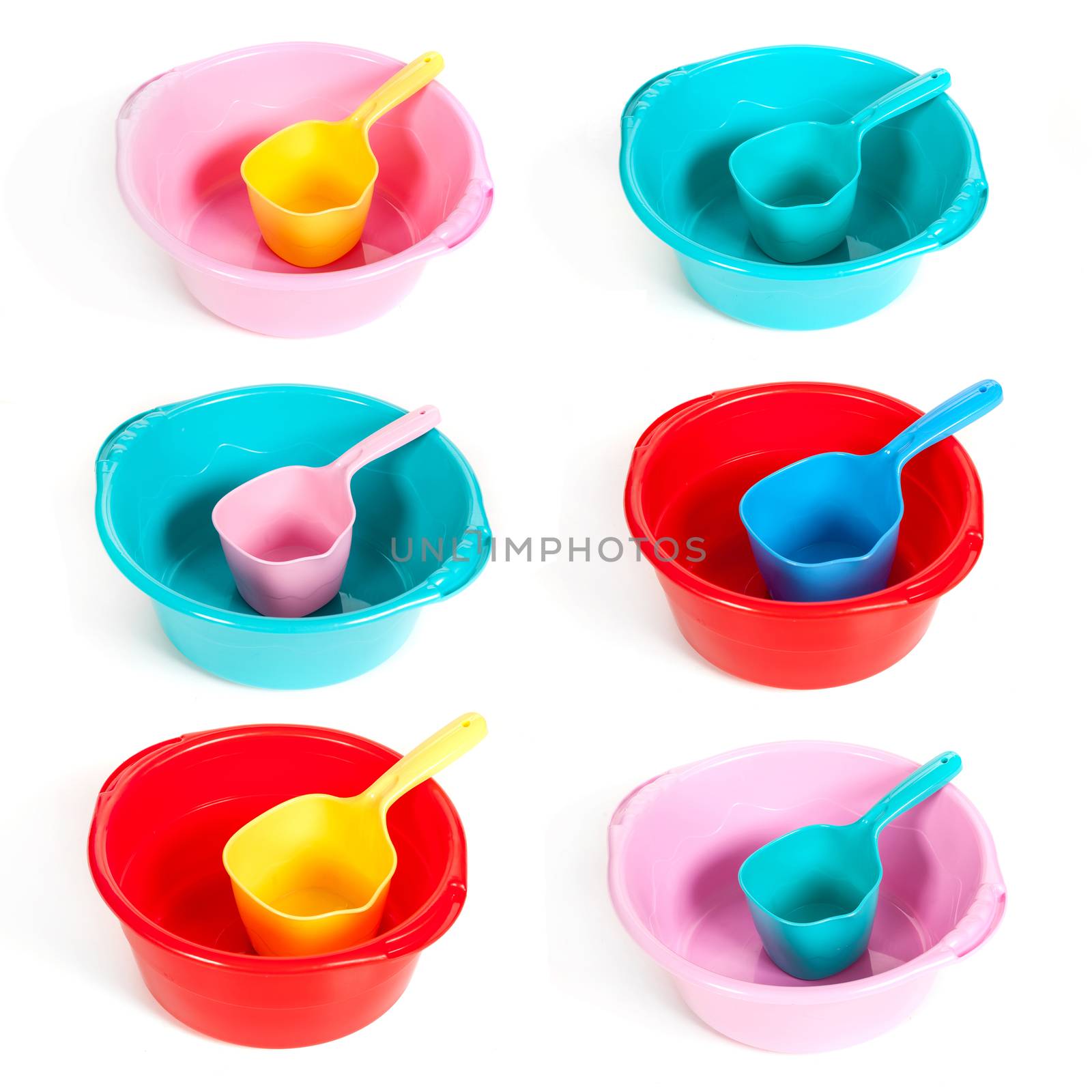 several plastic basins with ladles on the isolated white background