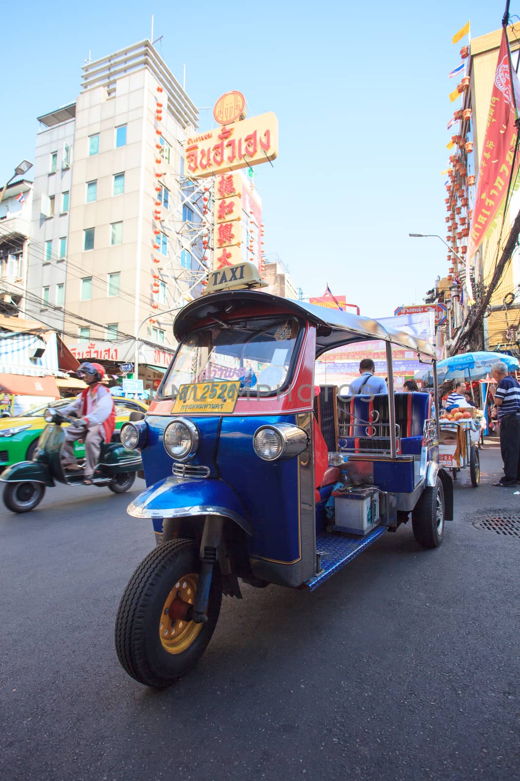 THAILAND,BANGKOK-FEB 24:TukTuk parking in Yaowarat Road main street in Chinatown,one of Bangkok landmark in bangkok on february24,2015 in China town, Bangkok Thailand
