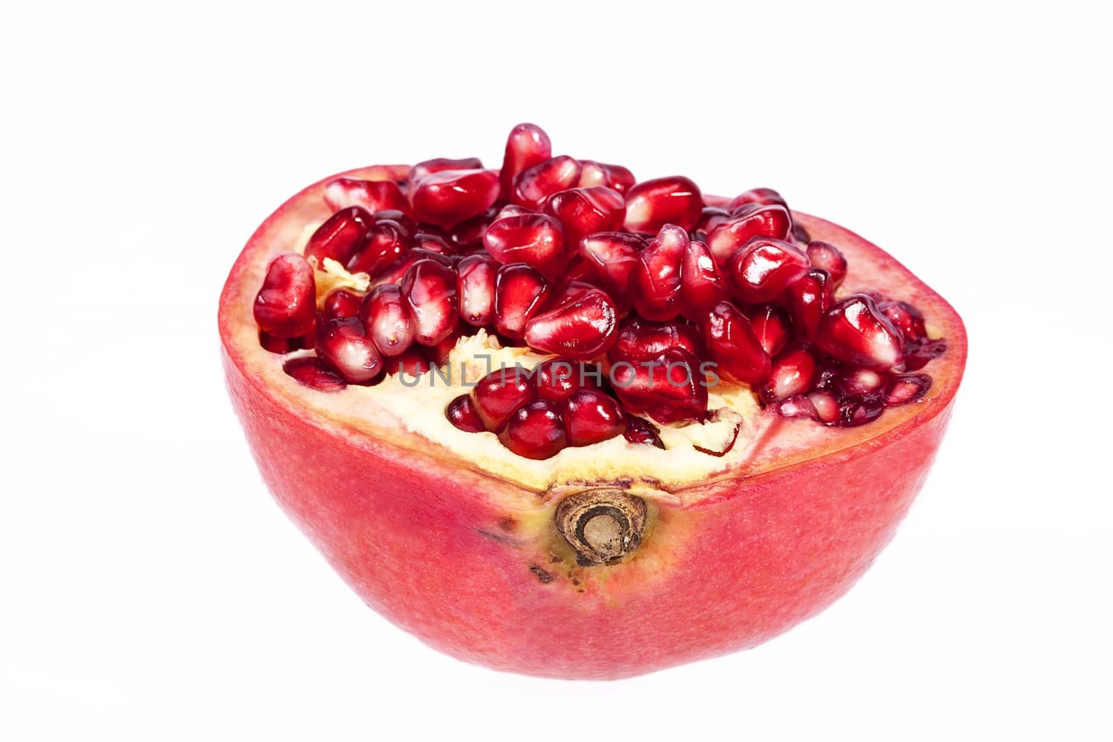  Half fruit of red pomegranate isolated on white background, close up.