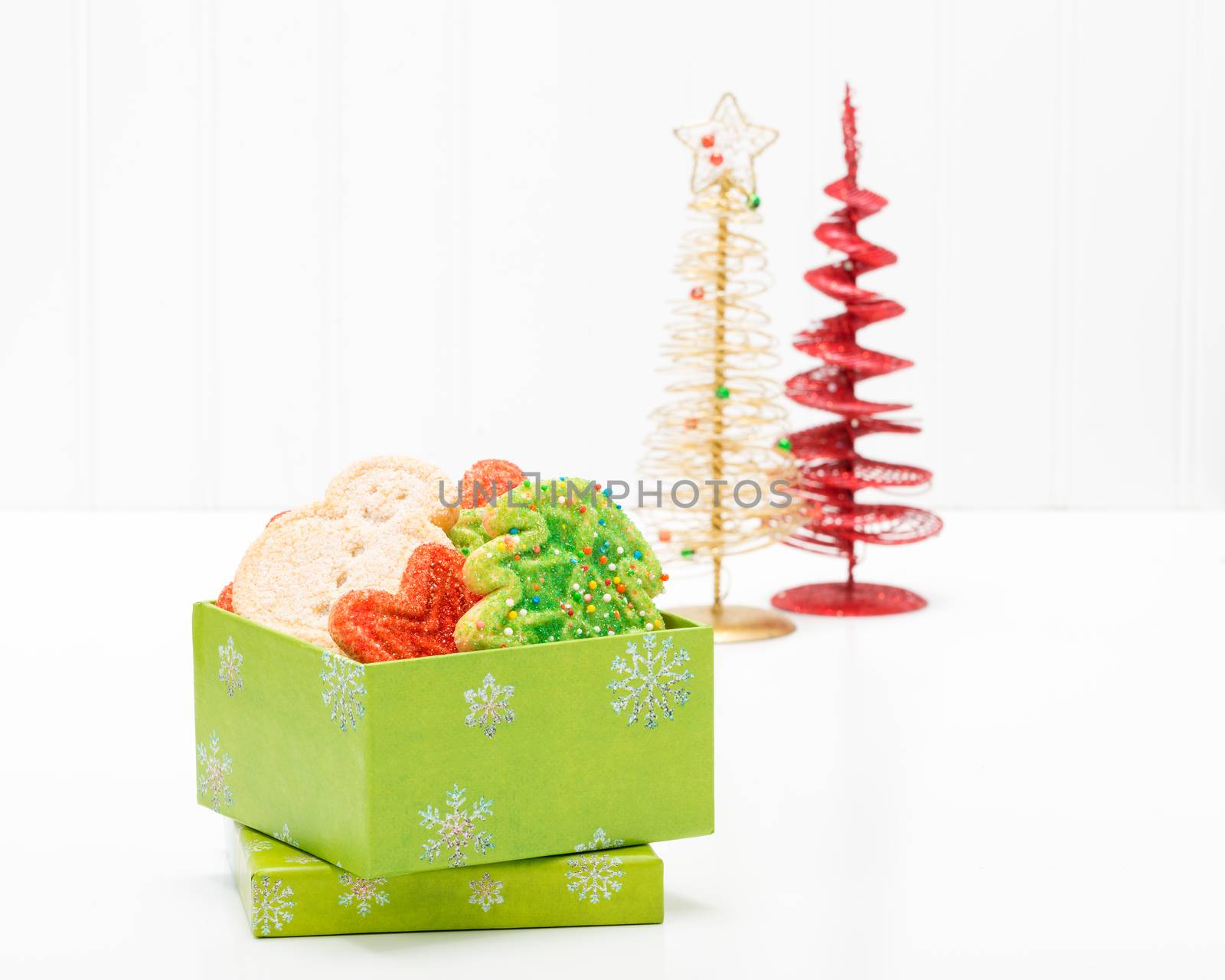 Variety of festive christmas sugar cookies in a gift box.