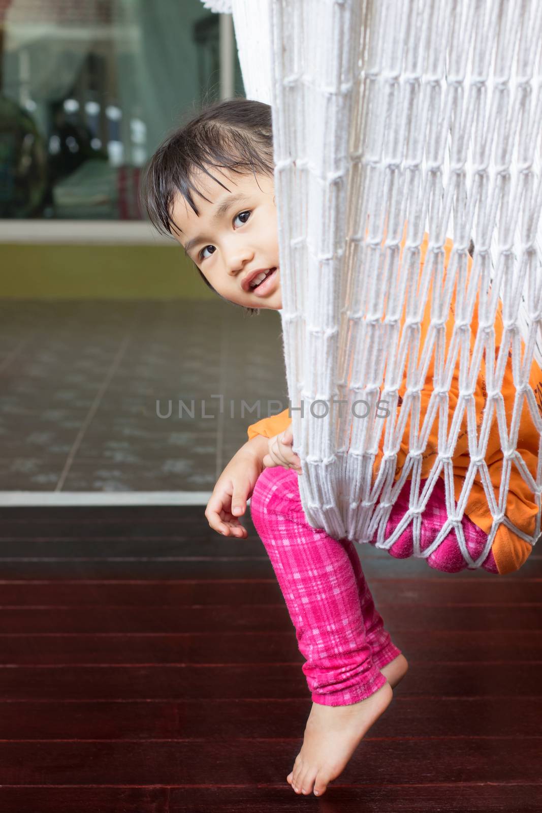 face of children sitting in clothes cradle and smiling use for f by khunaspix