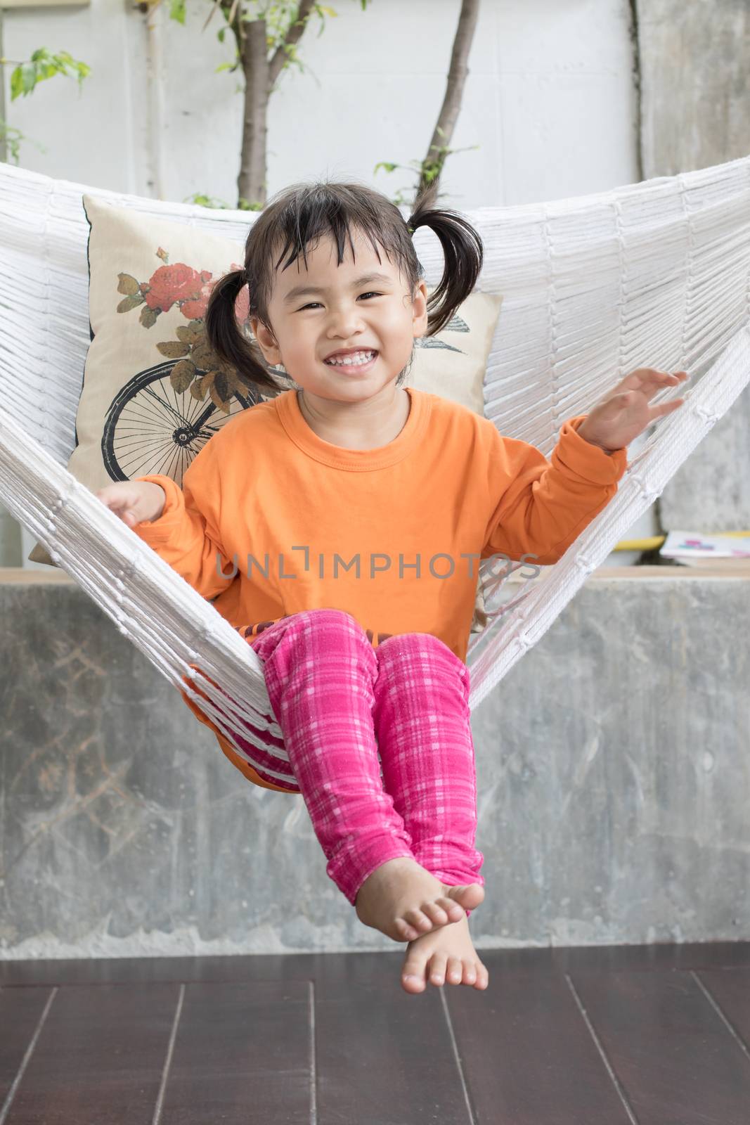 portrait of children toothy smiling and relaxing in clothes crad by khunaspix