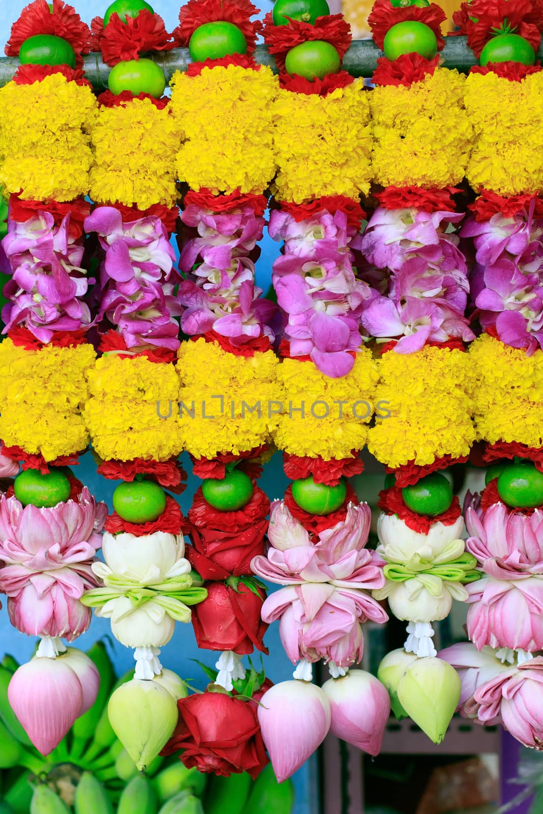 flowers hand decorated for Hindu temple praying by khunaspix