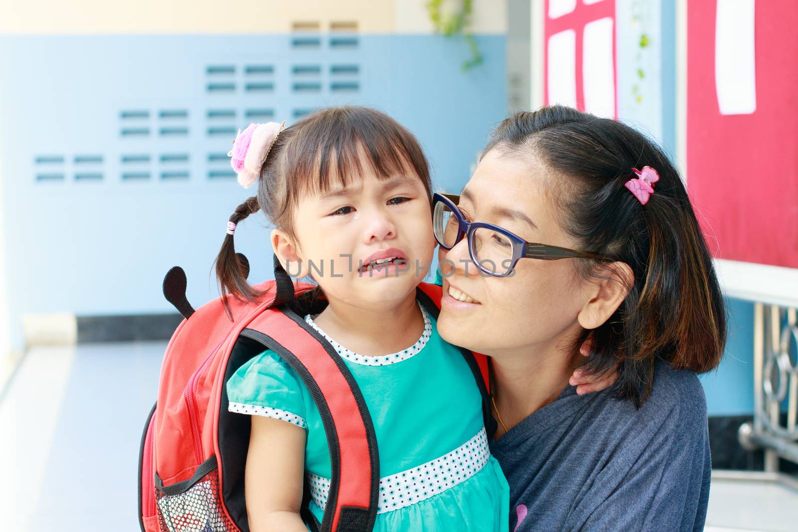 children and mother crying first day go to pre-kindergarten school 