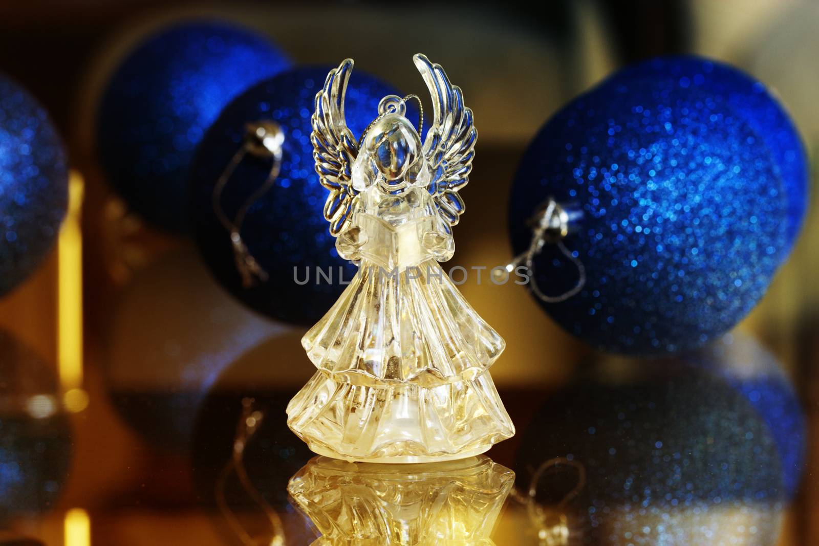 Crystal Angel on the background of Christmas balls. new Year decoration. Christmas ornaments, christmas decoration