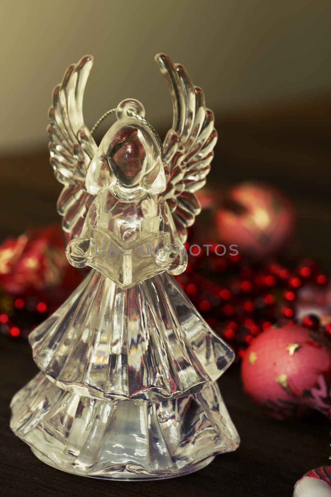 Crystal Angel on the background of Christmas balls. new Year decoration. Christmas ornaments, christmas decoration