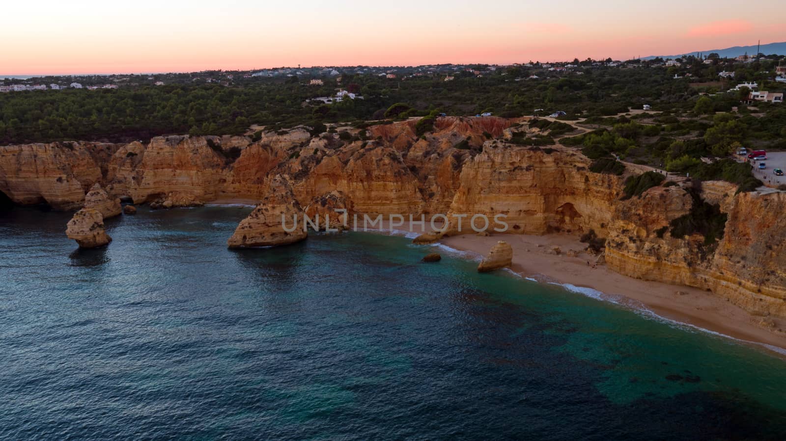 Aerial from famous beach Praia da Marinha in the Algarve Portugal at sunset