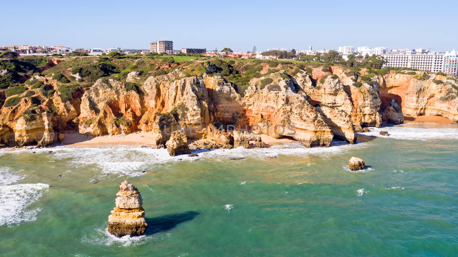 Aerial from rocks and ocean near Lagos in Portugal