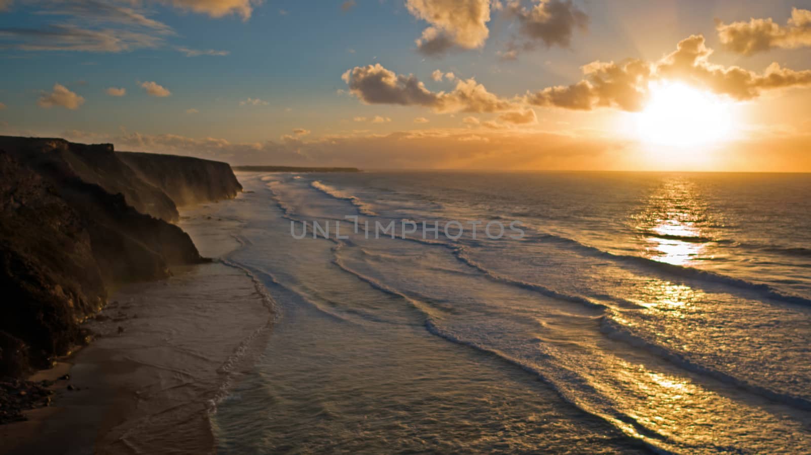 Aerial from a beautiful sunset at Vale Figueiras beach in Portugal