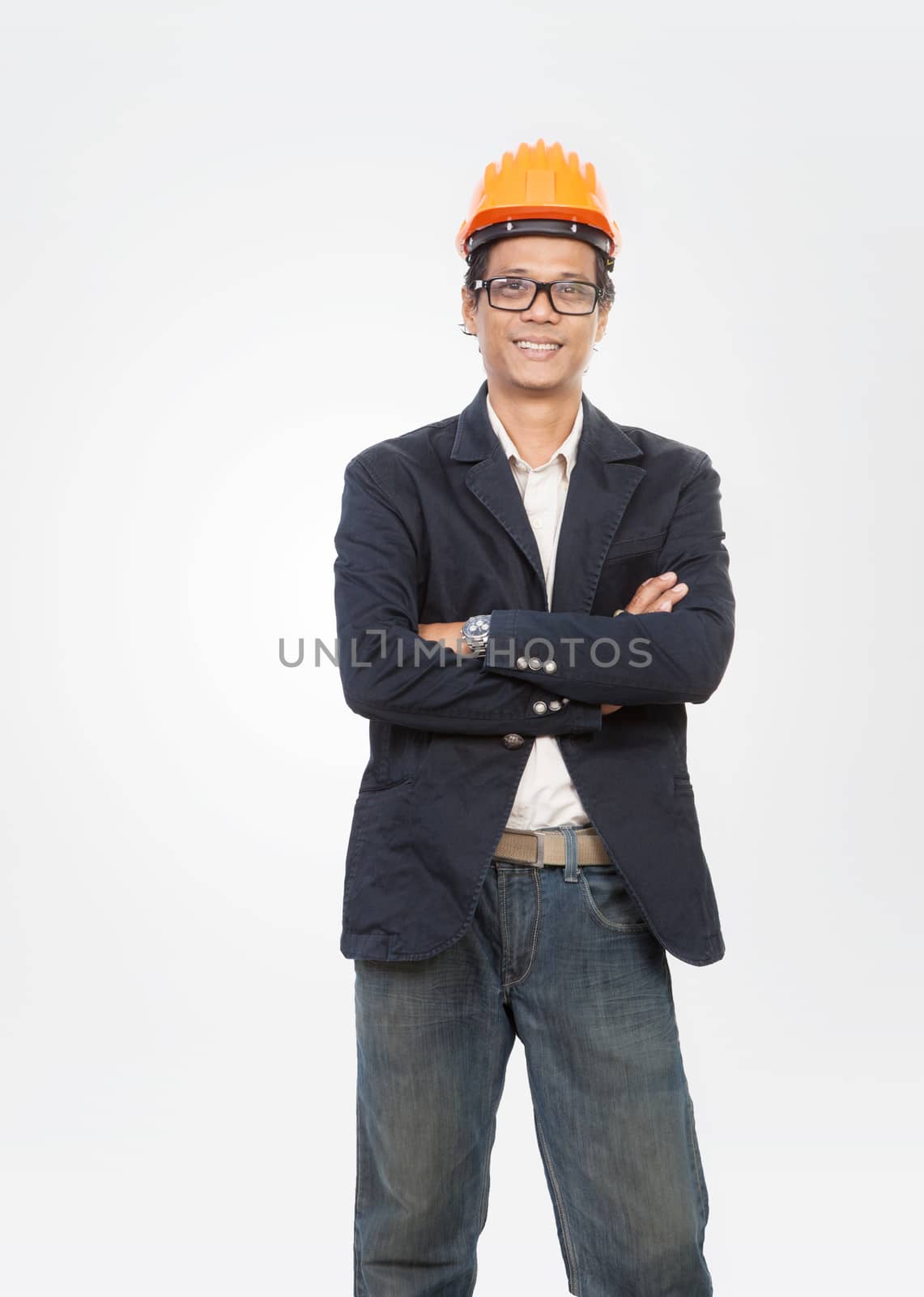 portrait of young engineer man standing with smiling face isolated white background
