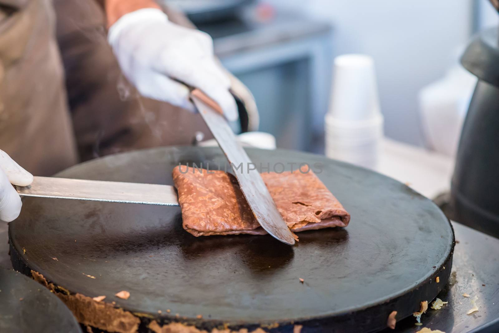 chocolate hot pancake fried on the stove