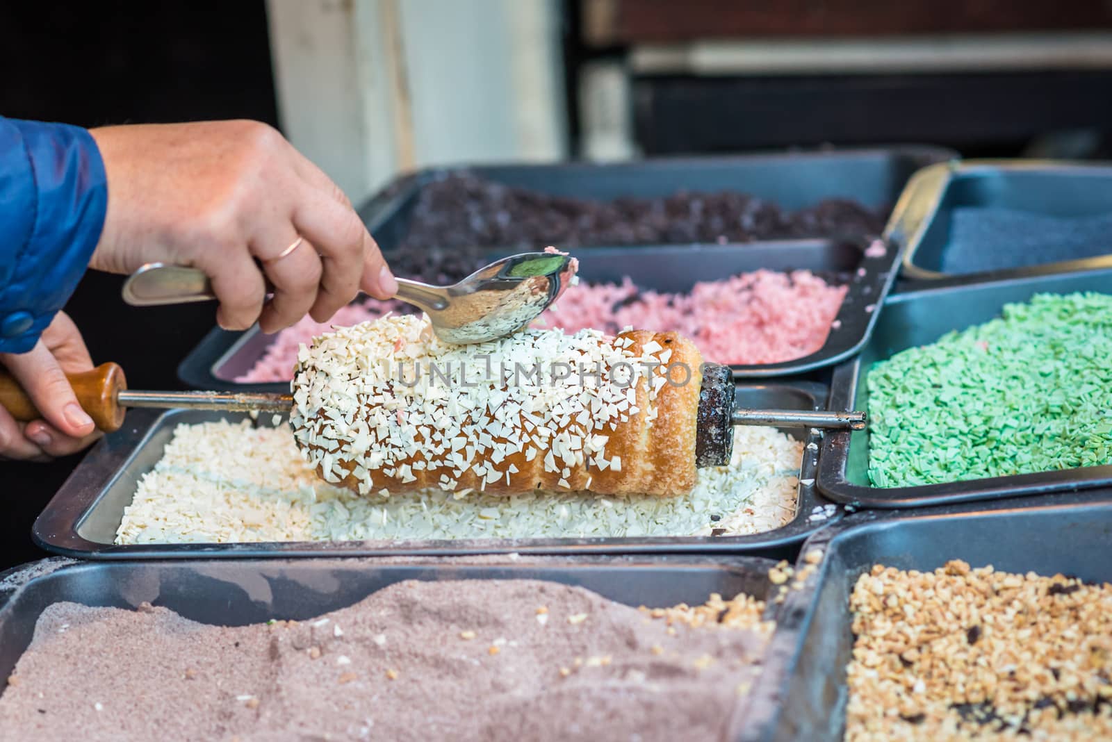 cake topped with white Sweet cereals during cooking