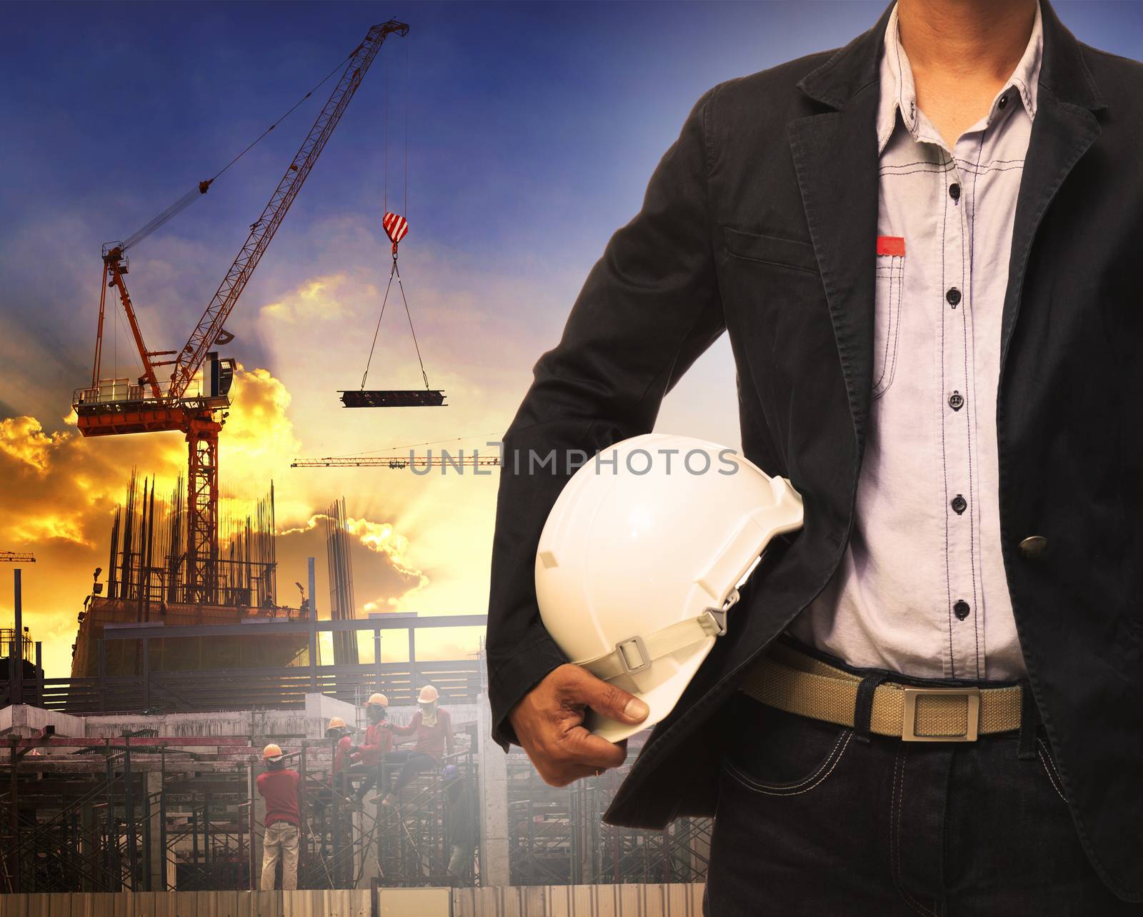 engineering man and white safety helmet working in construction  by khunaspix