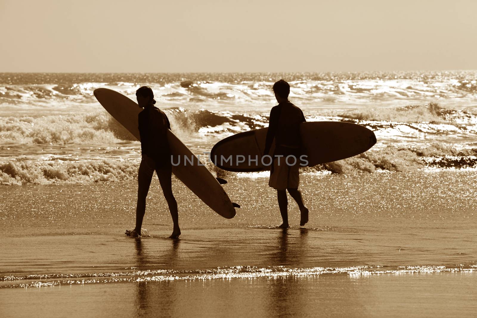 Surfers on a coastline by friday