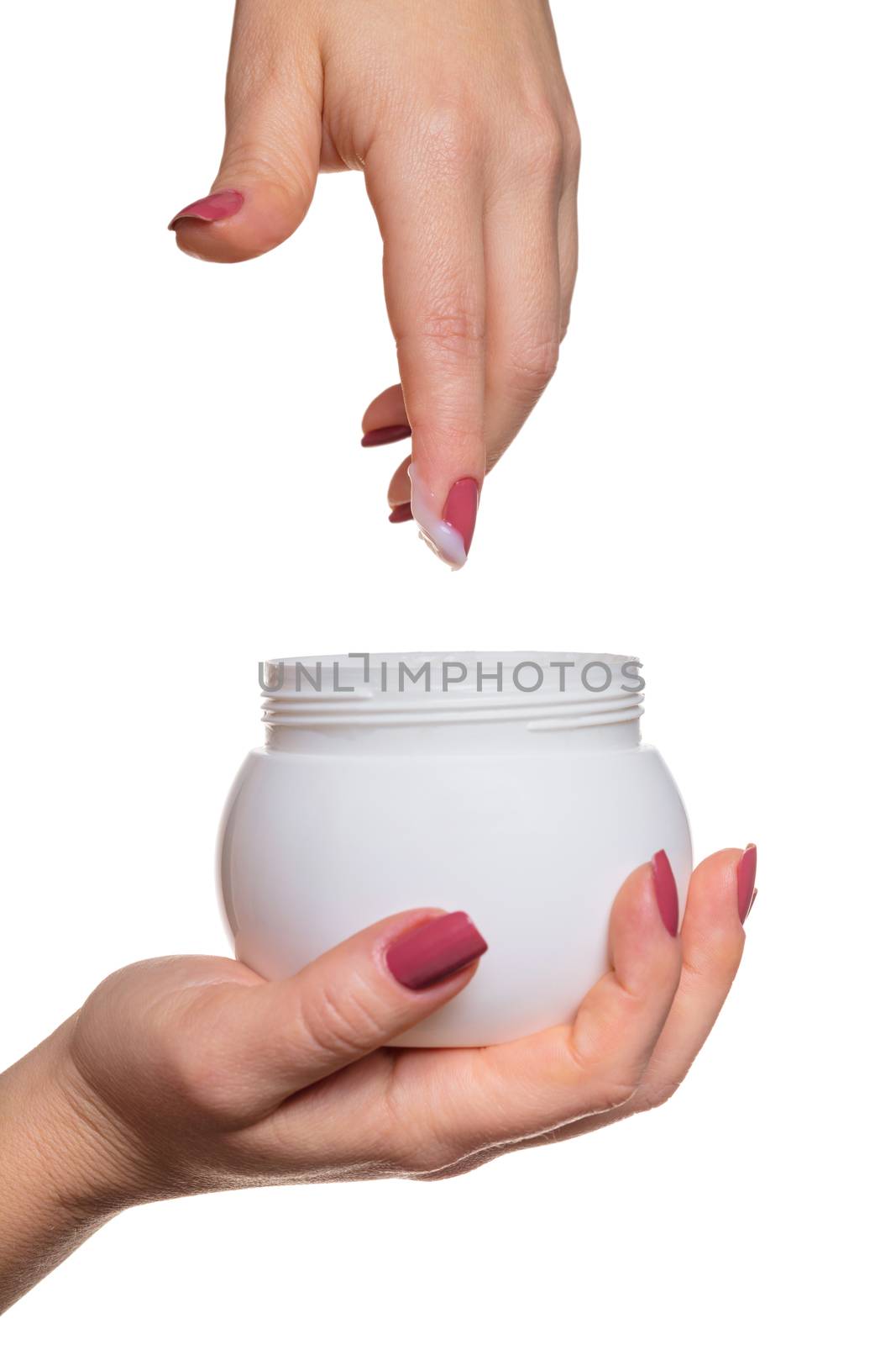 Hands with jar cosmetic cream on a white background