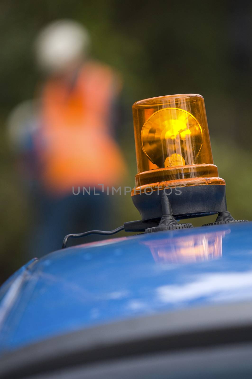 Orange flashing and revolving light on top of a support and services vehicle, France